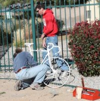 Ghost bike placement Steve and Mike putting the bike in place